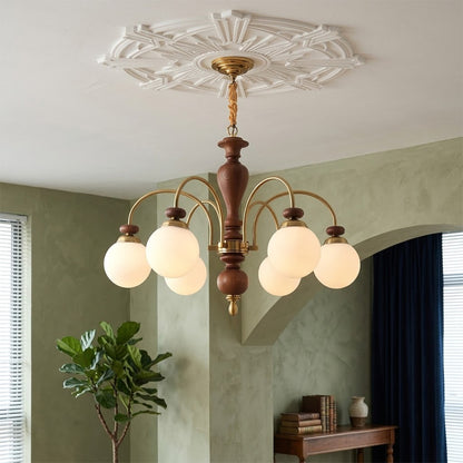 Windsor walnut chandelier  above dining table warm glowing light living room