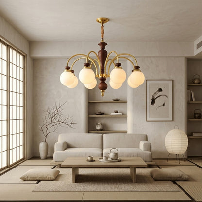 Windsor walnut chandelier  above dining table warm glowing light living room