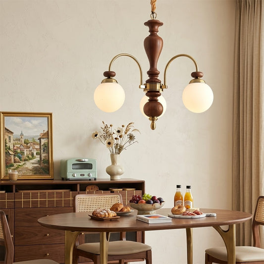 Windsor walnut chandelier  above dining table warm glowing light living room