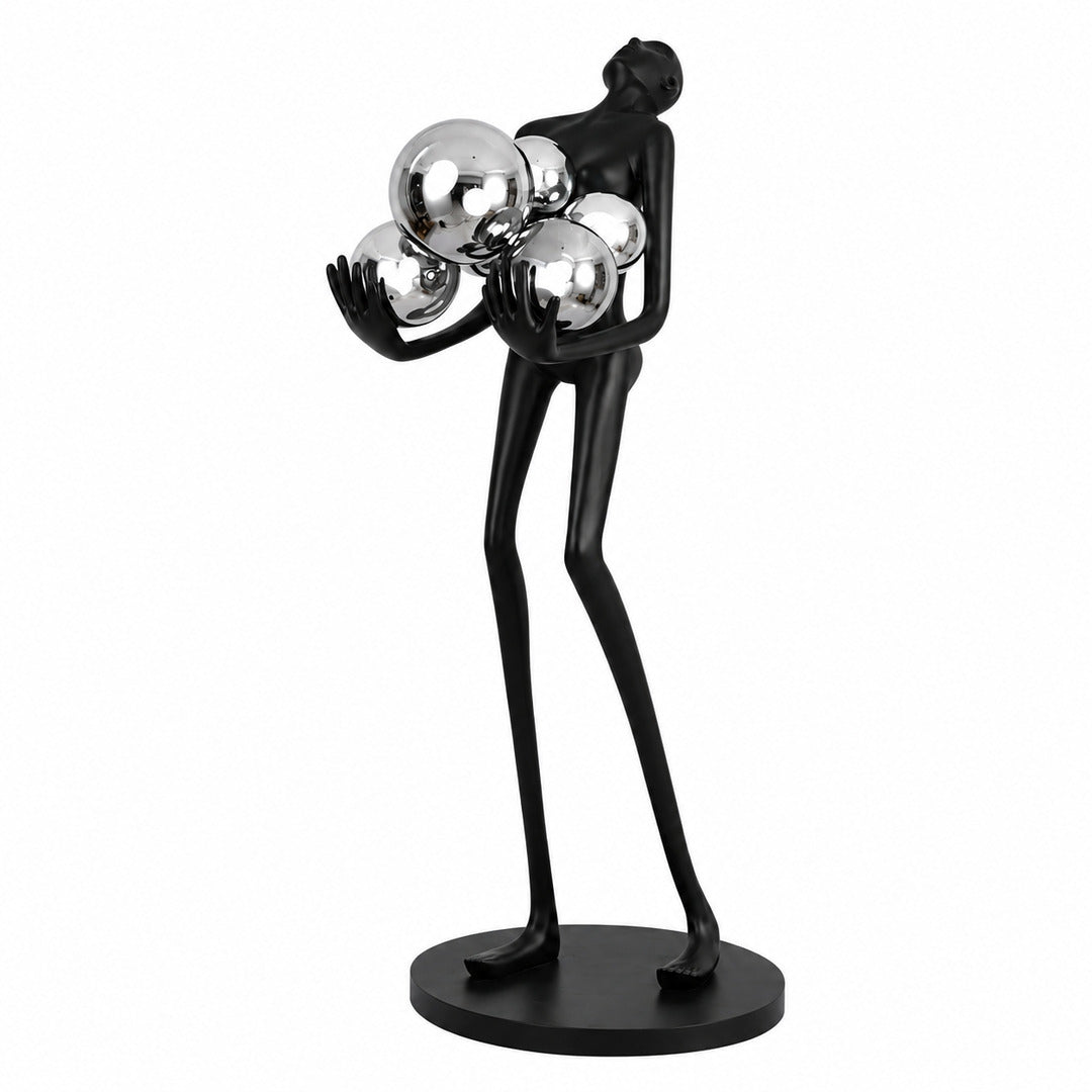 Abbraccio glass floor lamp with a sculptural cluster of glowing glass globes on a black frame in a living room