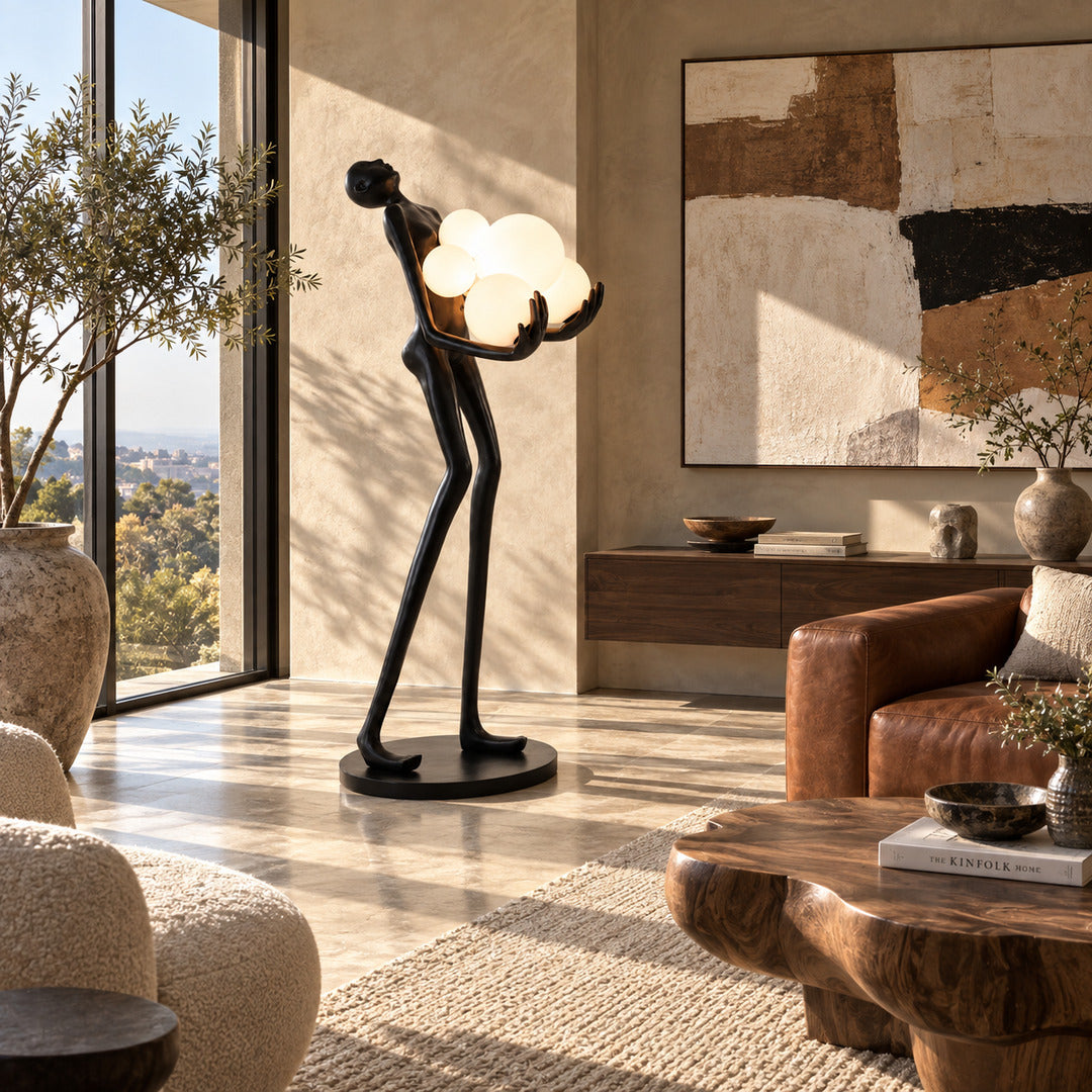 Abbraccio glass floor lamp filling a living room corner with a warm cluster of glowing globes