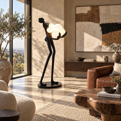 Abbraccio glass floor lamp filling a living room corner with a warm cluster of glowing globes