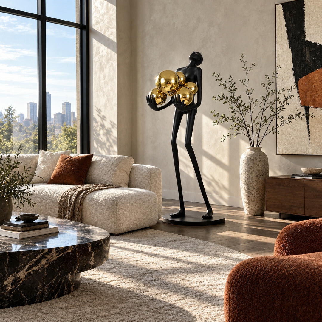 Abbraccio glass floor lamp standing beside a sofa as a sculptural centerpiece in a living room