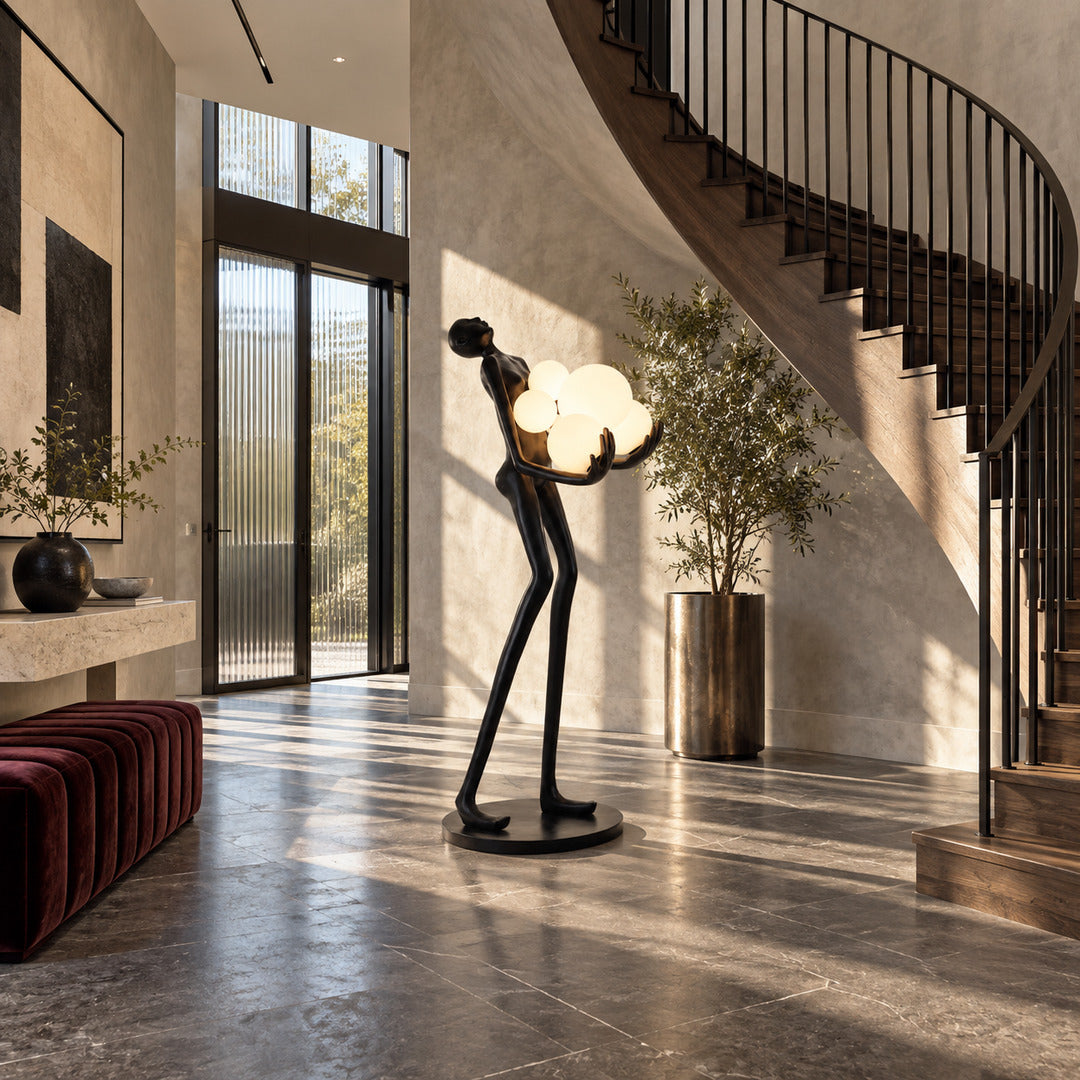 Abbraccio glass floor lamp welcoming guests with a sculptural glowing cluster in an entryway