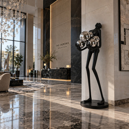 Abbraccio glass floor lamp filling a living room corner with a warm cluster of glowing globes