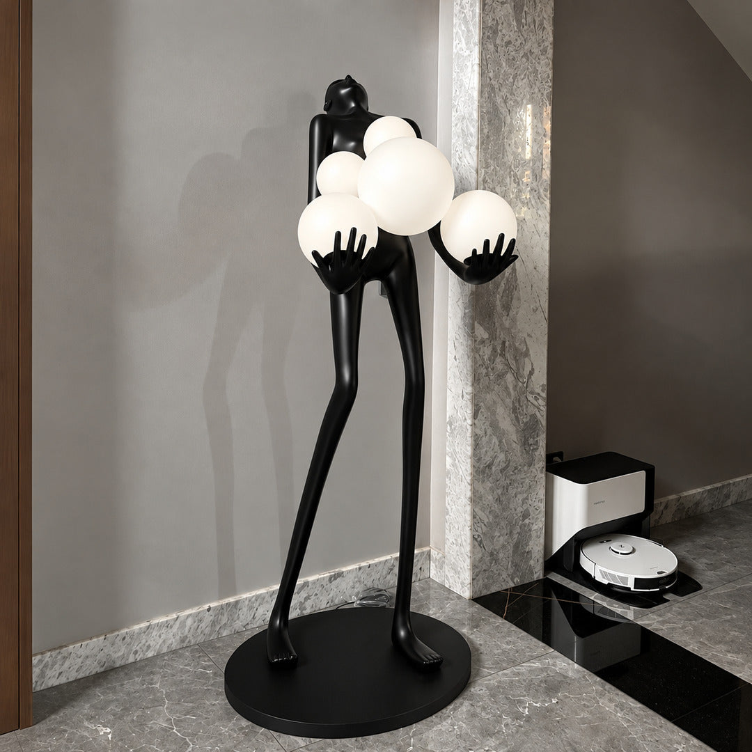 Abbraccio glass floor lamp filling a living room corner with a warm cluster of glowing globes