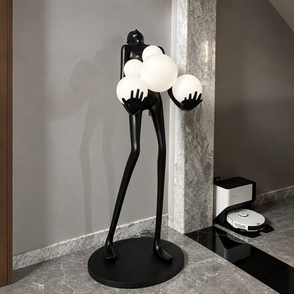Abbraccio glass floor lamp filling a living room corner with a warm cluster of glowing globes