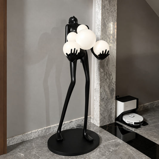 Abbraccio glass floor lamp filling a living room corner with a warm cluster of glowing globes
