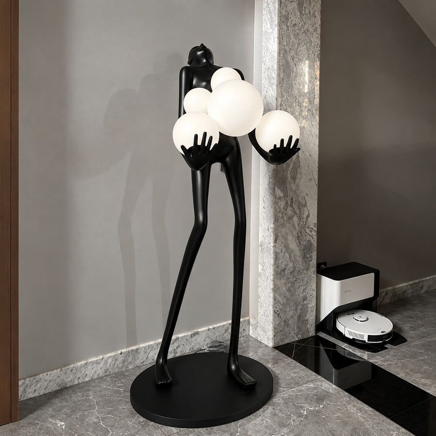 Abbraccio glass floor lamp filling a living room corner with a warm cluster of glowing globes
