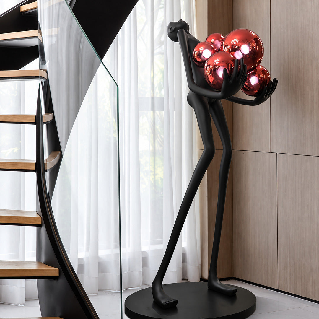 Abbraccio glass floor lamp filling a living room corner with a warm cluster of glowing globes