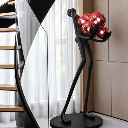 Abbraccio glass floor lamp filling a living room corner with a warm cluster of glowing globes