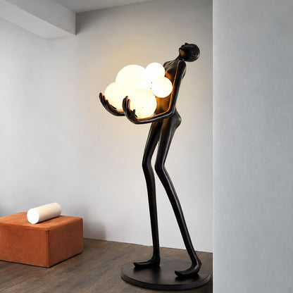 Abbraccio glass floor lamp filling a living room corner with a warm cluster of glowing globes