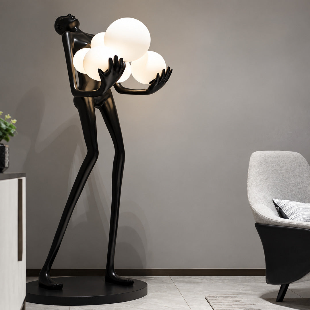 Abbraccio glass floor lamp filling a living room corner with a warm cluster of glowing globes