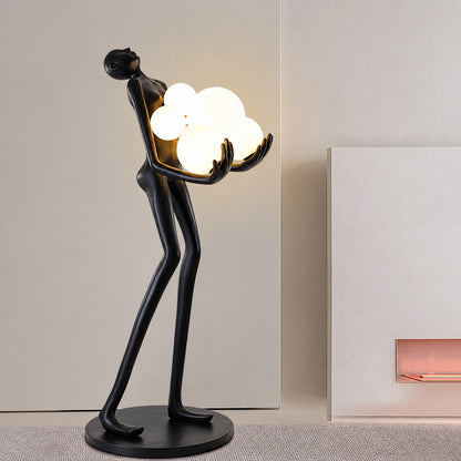 Abbraccio glass floor lamp filling a living room corner with a warm cluster of glowing globes