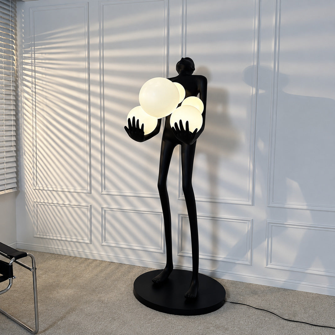 Abbraccio glass floor lamp adding a bold sculptural accent beside a modern master bedroom bed
