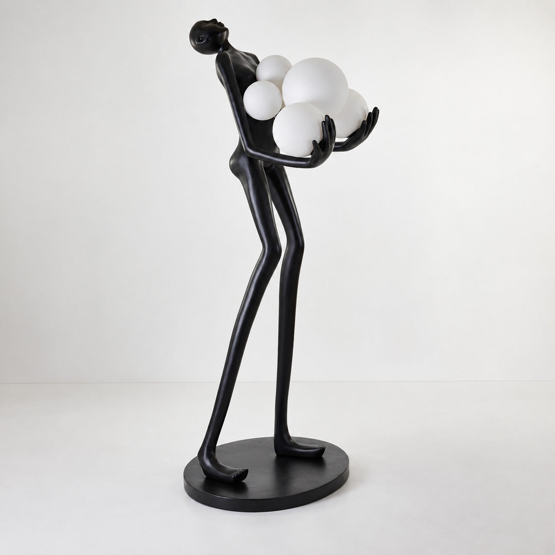 Close-up of the clustered glass globes embraced by the black frame of the Abbraccio floor lamp