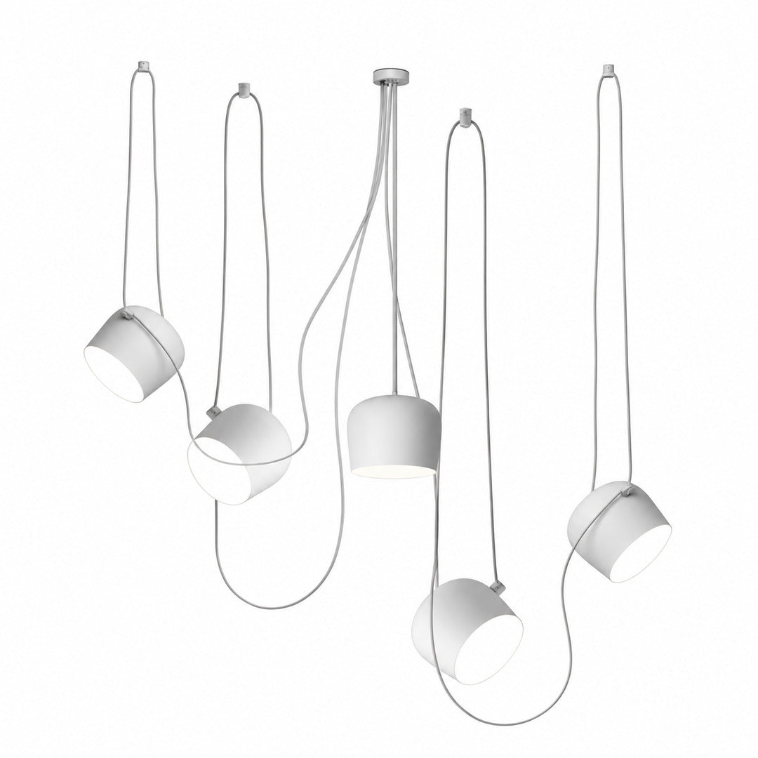 Five-head white Aim pendant light as a statement over a large island
