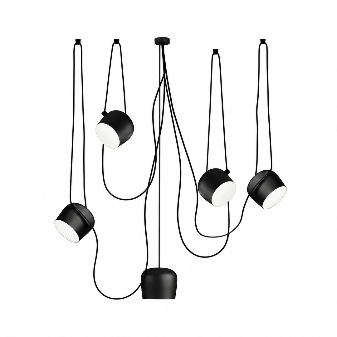 Five-head black Aim pendant light spanning a long dining or island counter