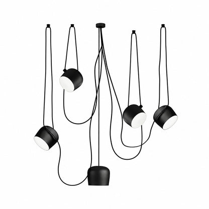 Five-head black Aim pendant light spanning a long dining or island counter