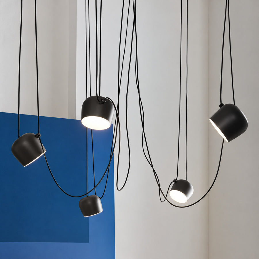 Aim adjustable pendant lights aimed over a modern kitchen island