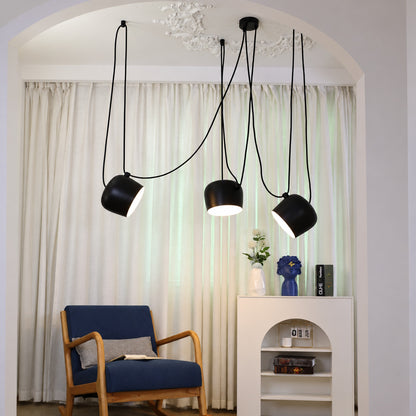 Aim pendant light directing a warm glow in a modern entryway