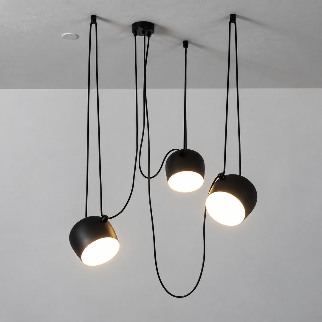 Close-up of the tilting adjustable shade on the Aim pendant light directing light at an angle
