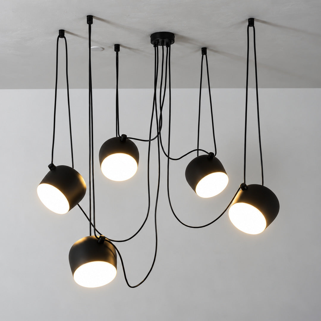 Close-up of the tilting adjustable shade on the Aim pendant light directing light at an angle