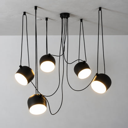 Close-up of the tilting adjustable shade on the Aim pendant light directing light at an angle