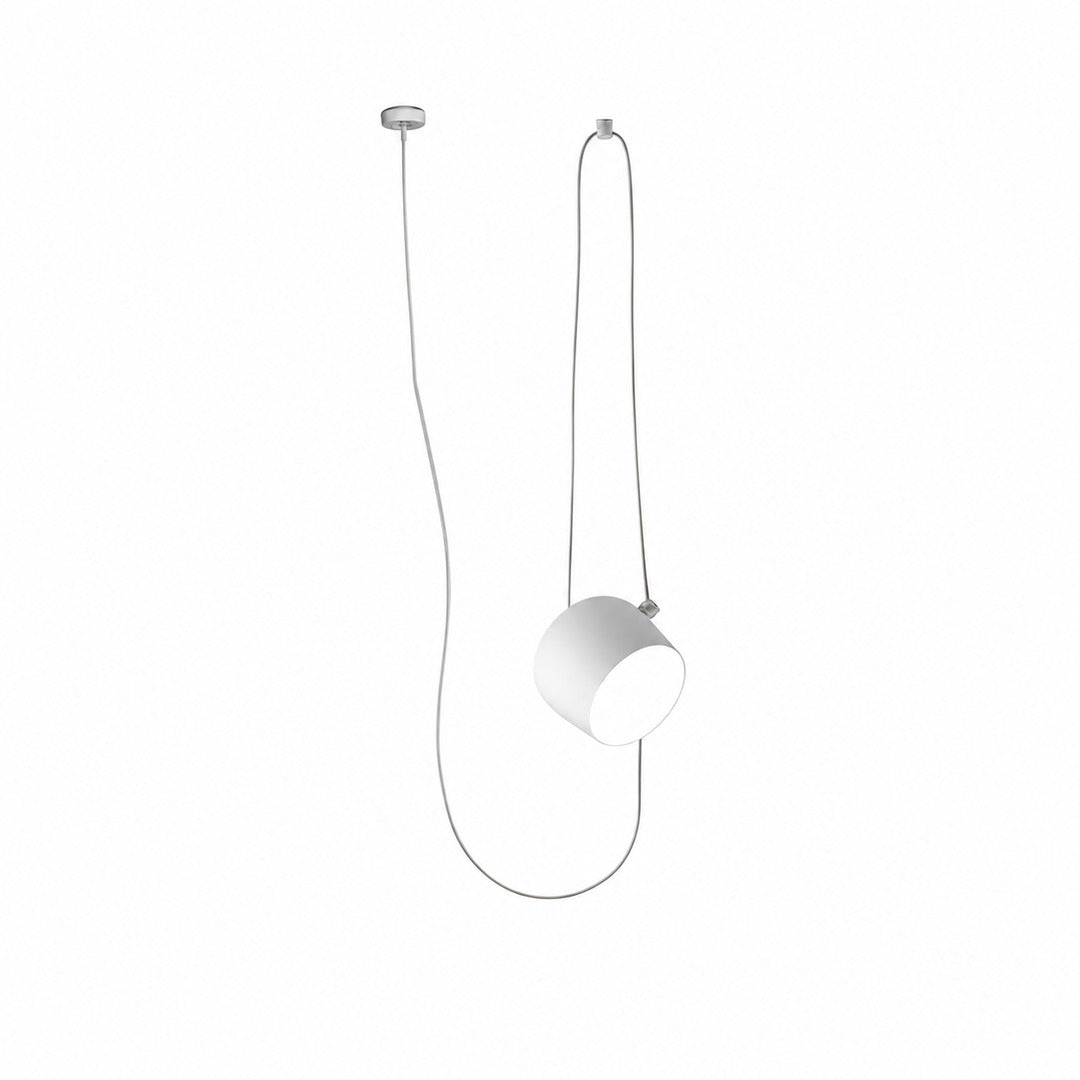 Single-head white Aim adjustable pendant light over a breakfast counter