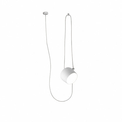 Single-head white Aim adjustable pendant light over a breakfast counter