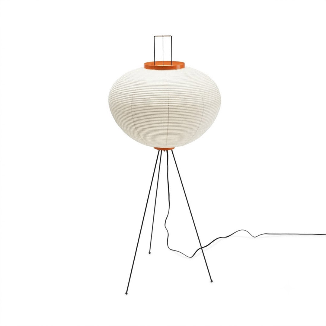 Minimalist Akari 10A floor lamp made of Japanese rice paper with black tripod legs, organic modern lantern standing light on a clean white background by Stuber Lighting.