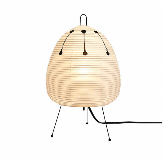 Stuber classic egg-shaped Washi paper table lamp on black tripod legs.