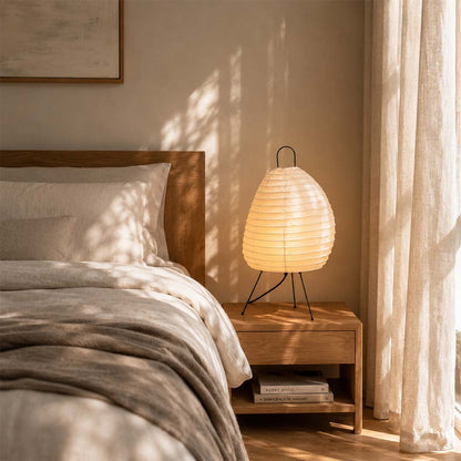 Warm bedroom ambient light from Akari 1N rice paper bedside lamp - stuberlighting