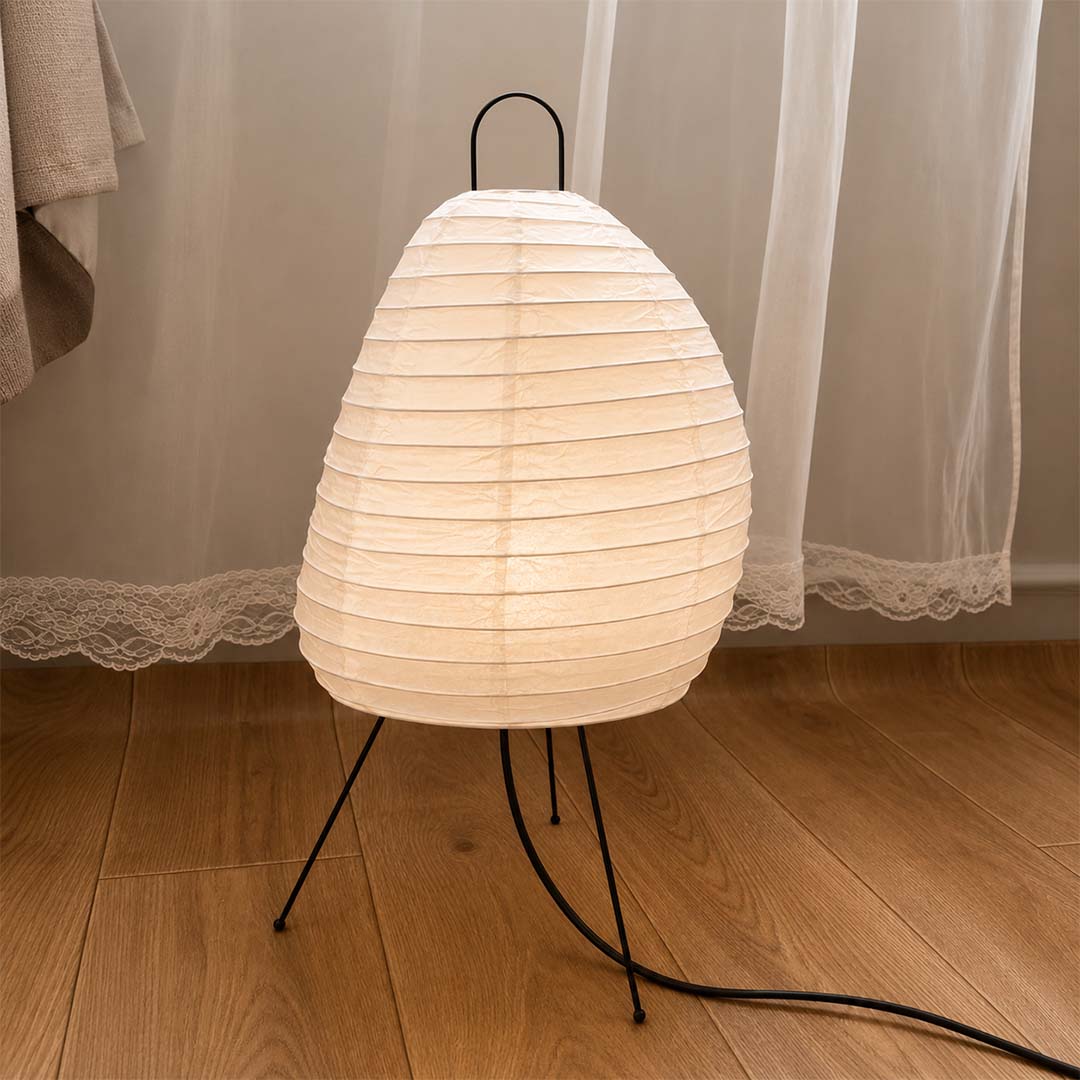 Minimalist room corner featuring Akari 1N paper lantern lamp on floor - stuberlighting