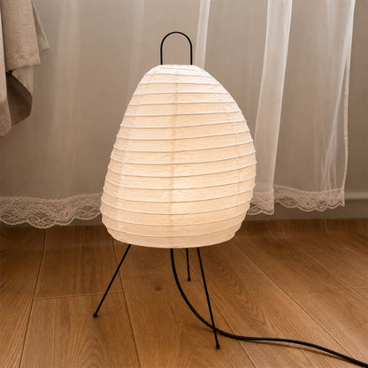 Minimalist room corner featuring Akari 1N paper lantern lamp on floor - stuberlighting