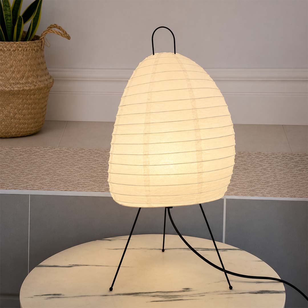 Art deco style Akari 1N table lamp placed on a wooden stool - stuberlighting
