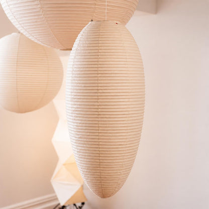 Close-up shot showing internal bamboo framework and warm light texture of Washi paper pendant lamp - stuberlighting