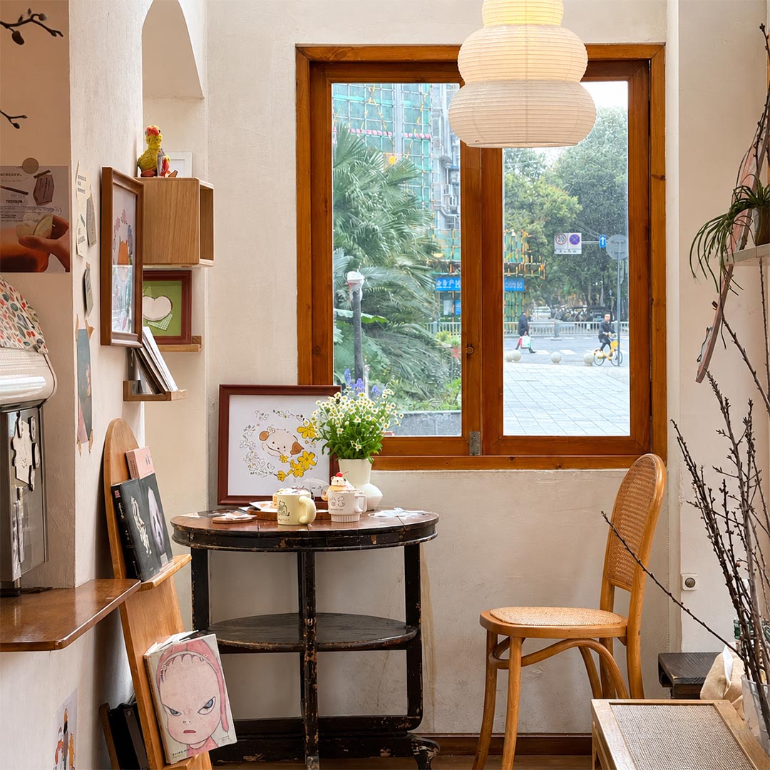 Retro aesthetic room corner by the window featuring Akari 24N ceiling light - Stuber Lighting