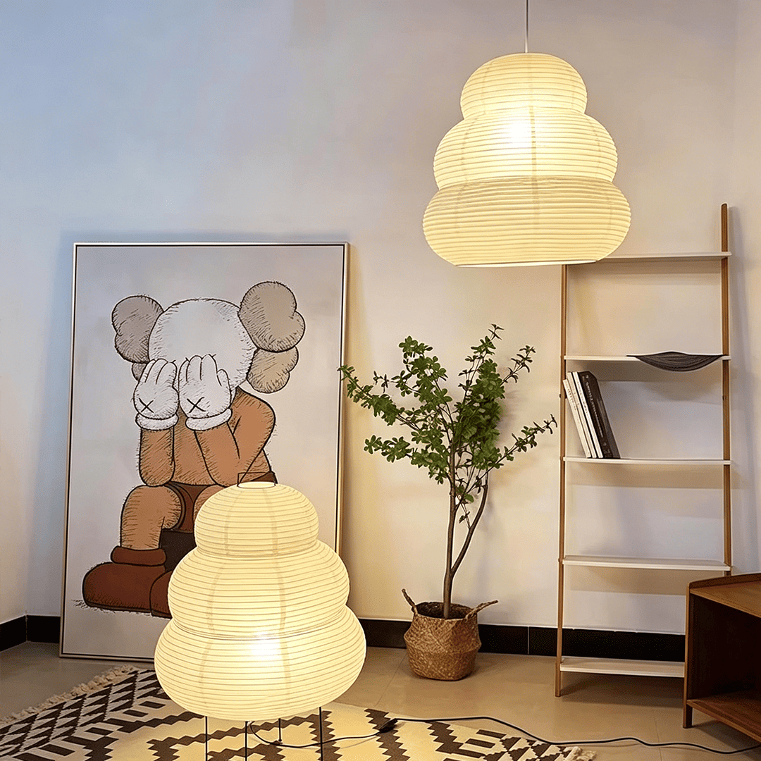 Creative living room display featuring Akari 24N pendant lamp and floor lamp combination - Stuber Lighting