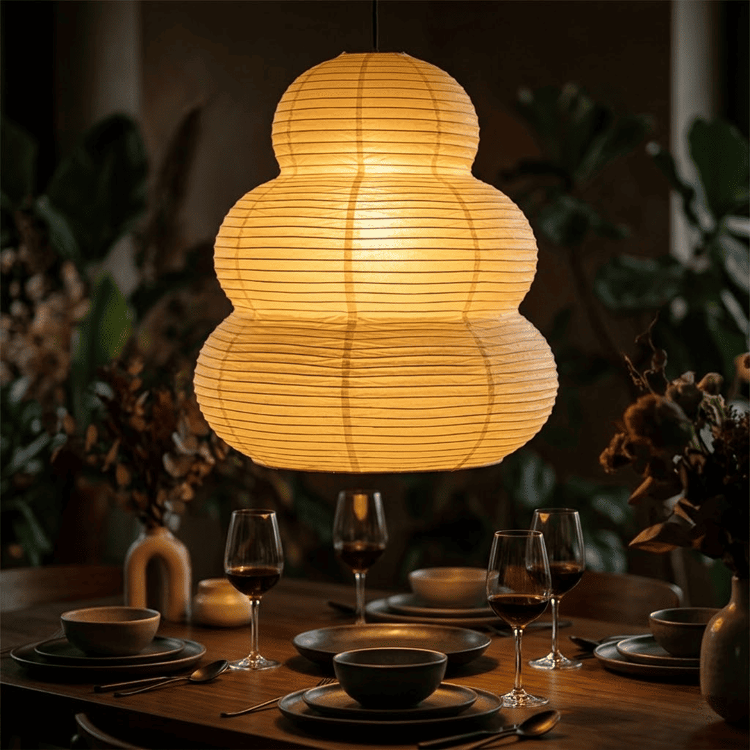 Minimalist wooden dining table illuminated by Akari 24N paper lantern light - Stuber Lighting