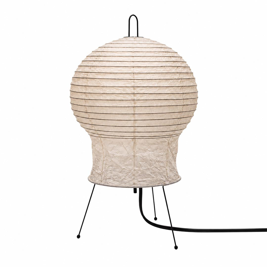 Close-up of the unlit textured paper shade of the Akari 2N Table Lamp on a white background by Stuber Lighting.