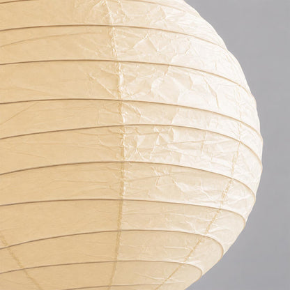 A macro close-up showing the crinkled texture and fine horizontal ribs of a high-quality Washi paper lamp shade in a natural cream color.