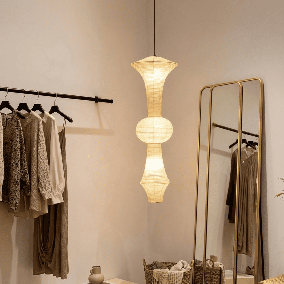 Akari E model pendant light in a minimalist dressing room setting.
