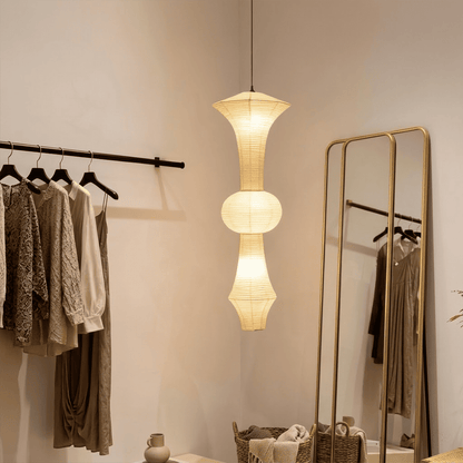 Akari E model pendant light in a minimalist dressing room setting.