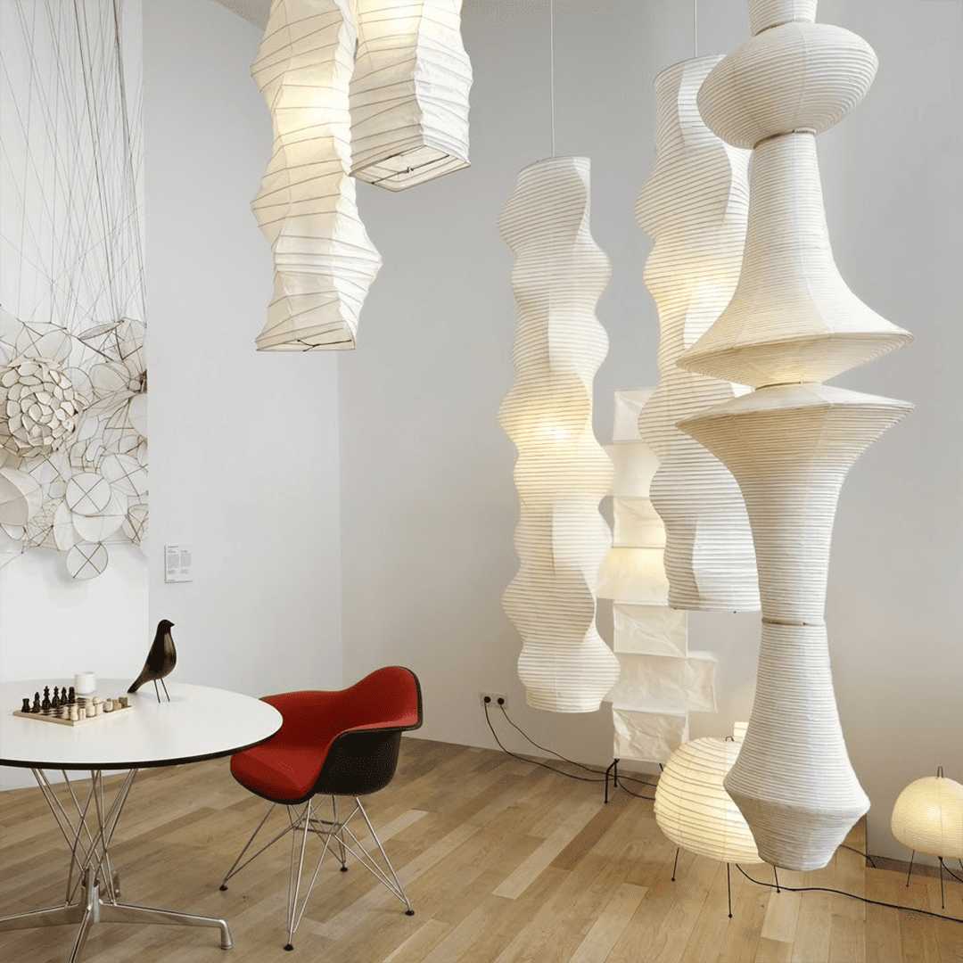 Akari E model pendant light in a minimalist dressing room setting.