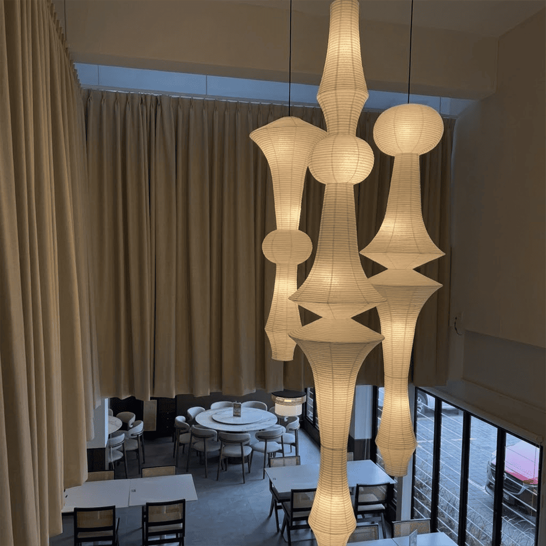 Akari E model pendant light in a minimalist dressing room setting.