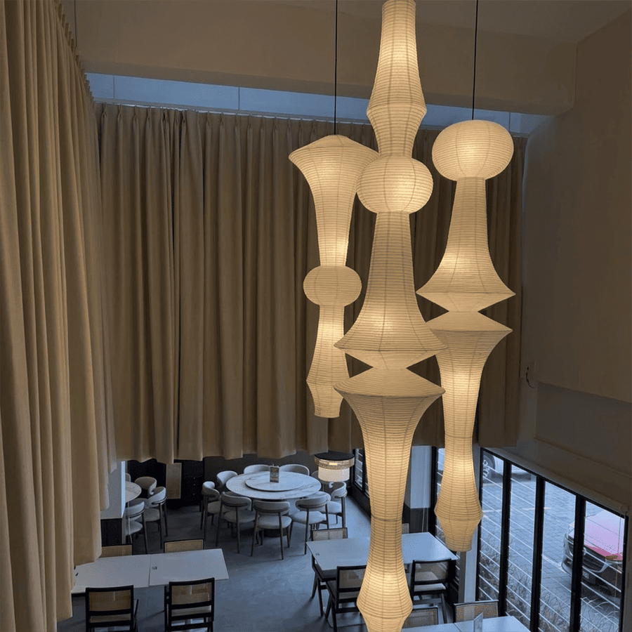 Akari E model pendant light in a minimalist dressing room setting.