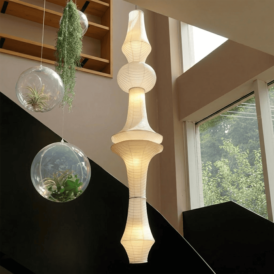 Akari E model pendant light in a minimalist dressing room setting.
