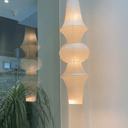 Akari E model pendant light in a minimalist dressing room setting.