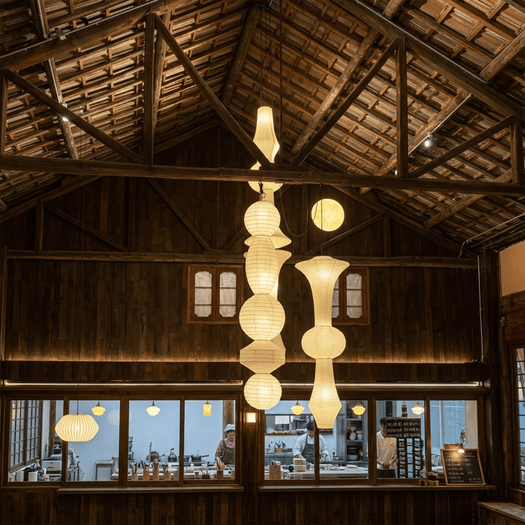 Akari E model pendant light in a minimalist dressing room setting.